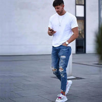 Mandotos men's jeans with stylish holes, classic fit and denim texture, displayed on a plain background.