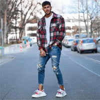 Mandotos men's jeans with stylish holes, classic blue denim, and modern distressed design for casual wear.