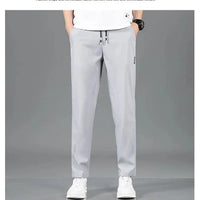 Mandotos Ice Silk men's summer black and gray casual pants with elastic waistband, breathable straight-leg design, suitable for outdoor wear.