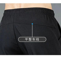 Mandotos Ice Silk men's summer pants in black and gray featuring a slim, straight-leg design, breathable and elastic for outdoor casual wear.