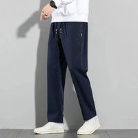 Mandotos Ice Silk men's summer casual pants in black and gray with elastic waistband, breathable straight-leg design, suitable for outdoor wear.