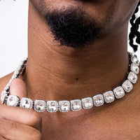 Mandotos Illumina Tennis Chain with clustered stones and radiant embellishments, showcasing elegant, sparkling jewelry design.