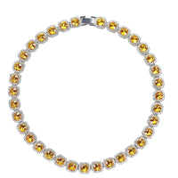 Mandotos Illumina tennis chain with clustered stones and radiant embellishments, showcasing elegant jewelry design.