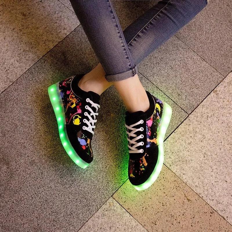 Mandotos LED light-up sneakers with glowing soles, featuring a stylish design perfect for nighttime wear and fun steps.