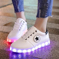 Mandotos LED light-up sneakers with sparkling soles, showcasing their vibrant, glowing design for stylish, illuminated steps.