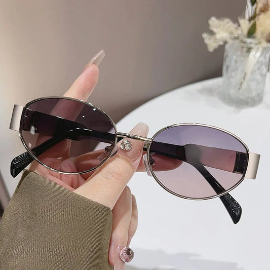 Women's geometric PC sunglasses with elliptical metal frames, large design, personalized style, by MANDOTOS INTERNATIONAL.