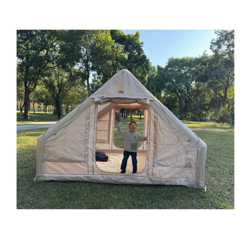 Large waterproof inflatable family tent by MANDOTOS INTERNATIONAL, ideal for outdoor camping with durable, airtight design.