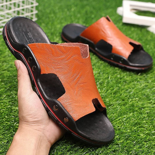 Retro leather men's summer beach slippers by MANDOTOS INTERNATIONAL with flat design and casual style for warm weather.