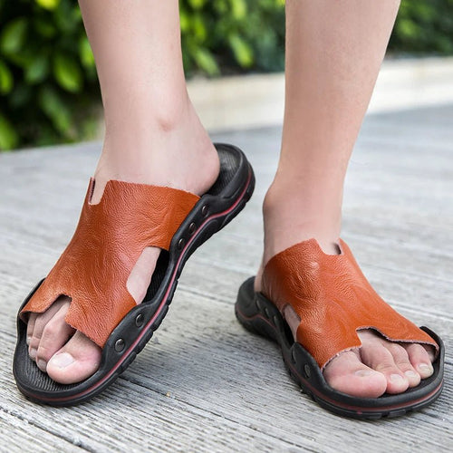 Retro leather men's summer beach slippers by MANDOTOS INTERNATIONAL featuring flat sandal design and comfortable slip-on style.