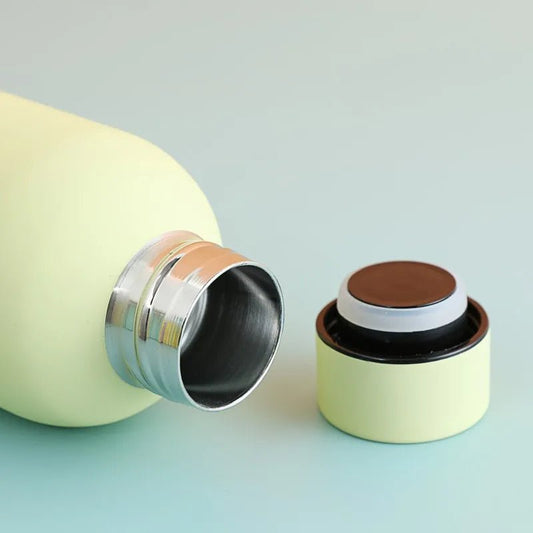 500ml stainless steel insulated sports water bottle by MANDOTOS INTERNATIONAL with a sleek design and leak-proof lid.