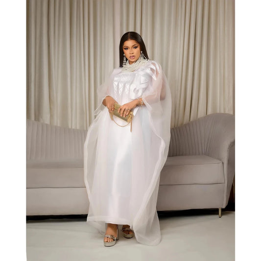 Elegant white African abaya for women with embroidery, plus size, suitable for parties or church events, by MANDOTOS INTERNATIONAL.
