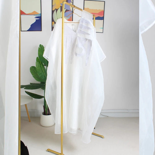 Elegant white African abaya for women with embroidery, plus size, suitable for parties or church events, by MANDOTOS INTERNATIONAL.