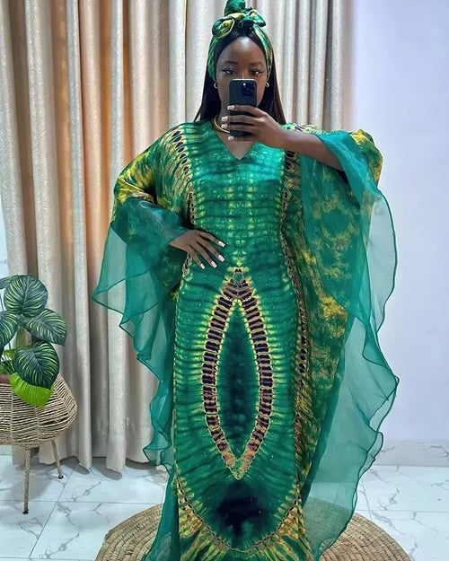 African Dashiki Ankara maxi dress for women by MANDOTOS INTERNATIONAL, featuring vibrant traditional African fabric and long flowing style.