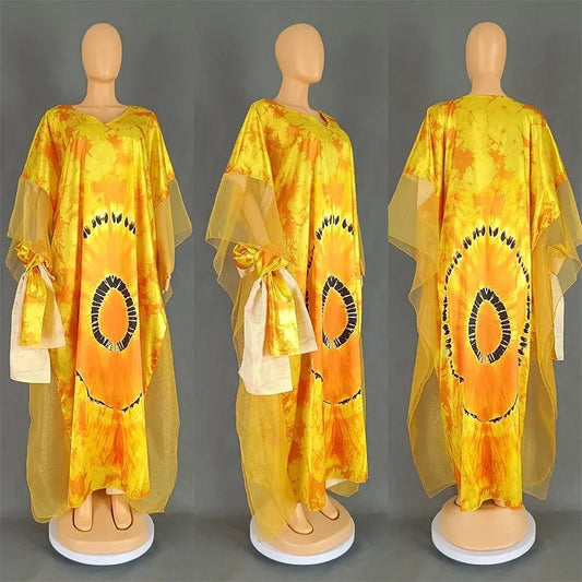 African Dashiki Ankara maxi dress for women, traditional long clothing with vibrant patterns by MANDOTOS INTERNATIONAL.