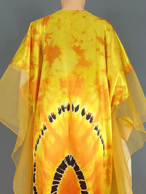 African Dashiki Ankara maxi dress for women, traditional long dress with vibrant patterns by MANDOTOS INTERNATIONAL.
