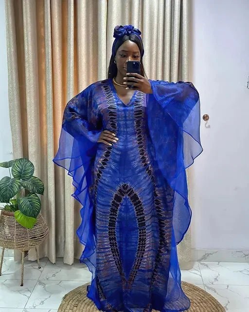 African Dashiki Ankara maxi dress for women by MANDOTOS INTERNATIONAL, featuring vibrant traditional floral patterns and flowing long style.