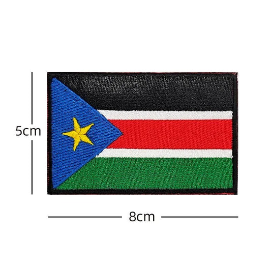 Embroidery patches featuring African flags and badges of Morocco, Nigeria, Gabon, Libya, and Namibia by MANDOTOS INTERNATIONAL.
