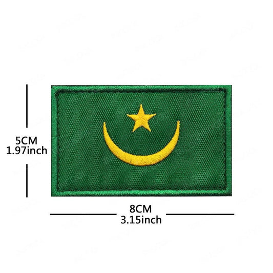 Embroidery patches of African flags and badges featuring Morocco, Nigeria, Gabon, Libya, and Namibia by MANDOTOS INTERNATIONAL.