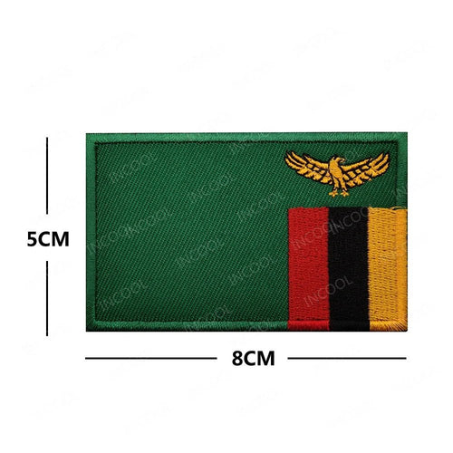Embroidery patches of African flags and badges featuring Morocco, Nigeria, Gabon, Libya, and Namibia by MANDOTOS INTERNATIONAL.
