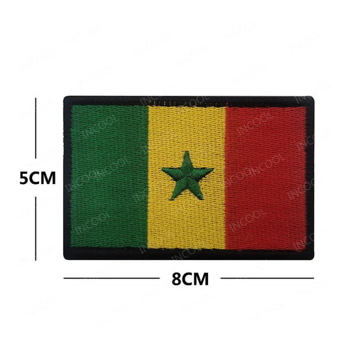 Embroidery patches of African flags and badges featuring Morocco, Nigeria, Gabon, Libya, and Namibia by MANDOTOS INTERNATIONAL.