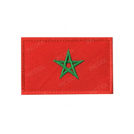 Embroidery patches of African flags and badges featuring Morocco, Nigeria, Gabon, Libya, and Namibia by MANDOTOS INTERNATIONAL.