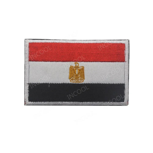 Embroidery patches featuring African flags and badges from Morocco, Nigeria, Gabon, Libya, and Namibia by MANDOTOS INTERNATIONAL.