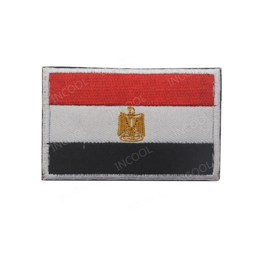 Embroidery patches featuring African flags and badges from Morocco, Nigeria, Gabon, Libya, and Namibia by MANDOTOS INTERNATIONAL.