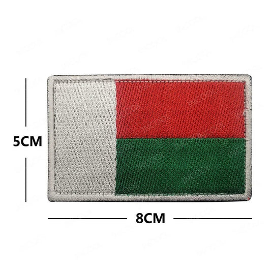 Embroidery patches of African flags and badges from Morocco, Nigeria, Gabon, Libya, and Namibia by MANDOTOS INTERNATIONAL.