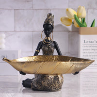 African girl holding a plate sculpture, vintage decorative storage ornament for home or office décor by MANDOTOS INTERNATIONAL.