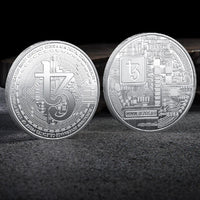 Mandotos International collection of physical metal crypto coins including Bitcoin, Ethereum, Dogecoin, and more in plastic case.