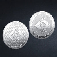 Mandotos International collection of physical metal crypto coins featuring Bitcoin, Ethereum, Dogecoin, and more in a plastic case.
