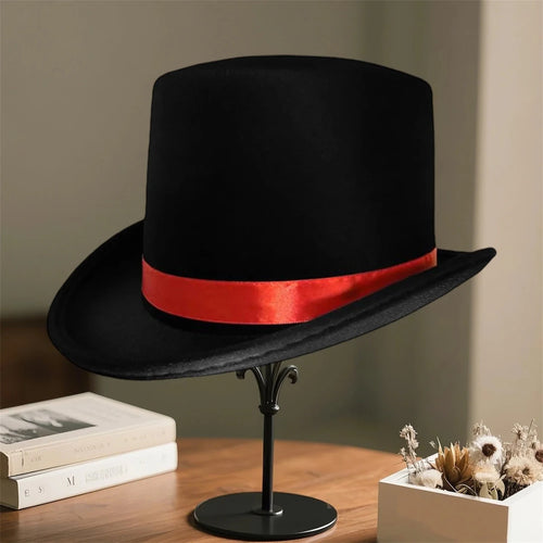 Elegant black top hat for adults costume, ideal for magicians and formal wear, featuring a classic design by MANDOTOS INTERNATIONAL.