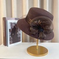 Elegant floral top hat from MANDOTOS INTERNATIONAL, suitable for autumn winter fashion, weddings, and parties, featuring a stylish fedora design.