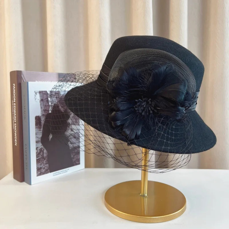 Elegant floral top hat for women by MANDOTOS INTERNATIONAL, suitable for autumn winter weddings and parties.