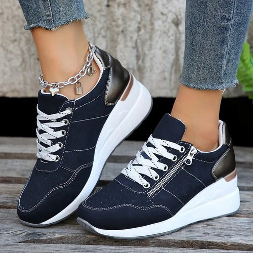 Fashionable lace-up sneakers with zipper detail and medium heel height by MANDOTOS INTERNATIONAL, showcasing stylish footwear design