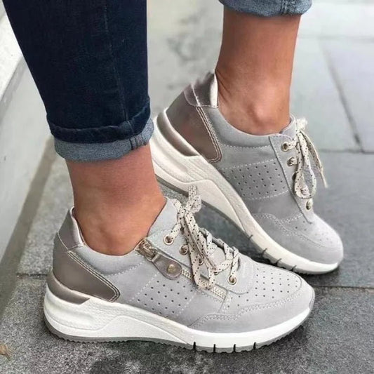 Fashionable lace-up sneakers with zipper detail and medium heel height by MANDOTOS INTERNATIONAL, shown in a stylish design.