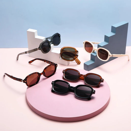 Black foldable retro oval sunglasses with UV400 polarized lenses and TR90 frame, unisex style by MANDOTOS INTERNATIONAL.