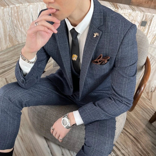 British Korean style plaid men's 3-piece business casual suit set by MANDOTOS INTERNATIONAL, featuring a tailored jacket, vest, and trousers.