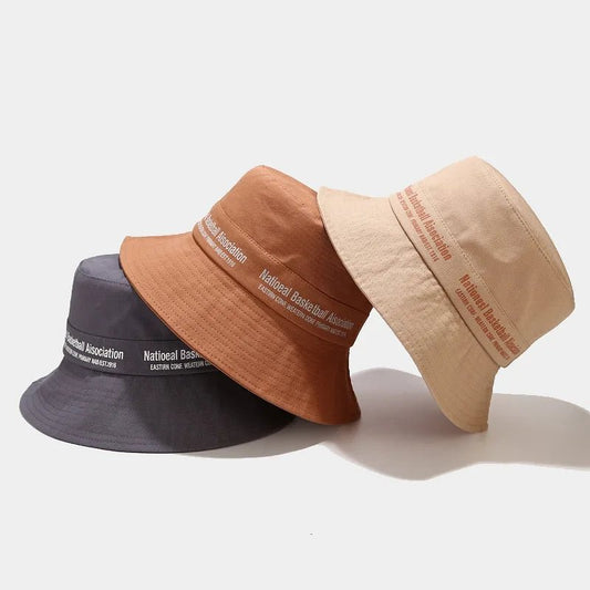 Beige twill cotton summer sun hat with custom silk screen logo, designed for sun protection and casual style by MANDOTOS INTERNATIONAL.