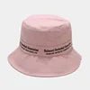Beige cotton summer sun hat with custom silk screen logo, high-quality twill fabric, wide brim for sun protection, by MANDOTOS INTERNATIONAL.
