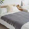 Knitted wool throw with tassels from MANDOTOS INTERNATIONAL, cozy home decor and travel blanket, soft and warm.