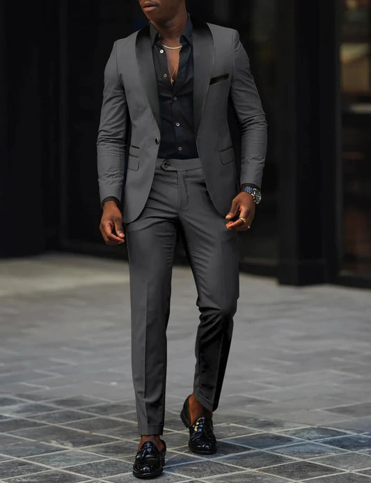 Men's slim-fit business casual suit jacket and trousers by MANDOTOS INTERNATIONAL, shown on a model.