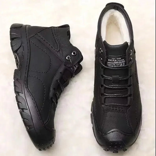 Men's winter ankle boots by MANDOTOS INTERNATIONAL, waterproof and non-slip work shoes, showing sturdy design and rugged soles.