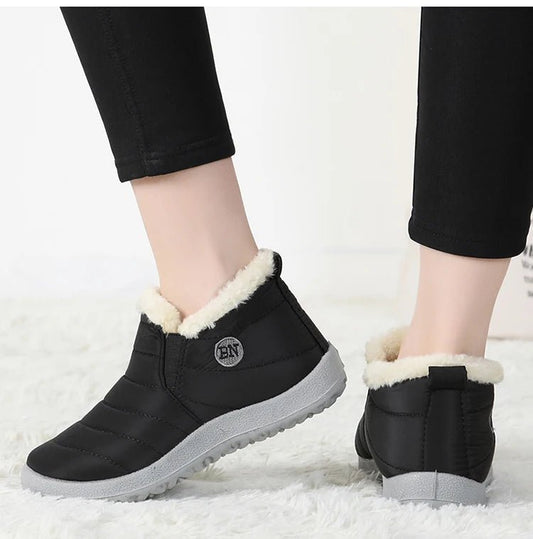 Men's waterproof winter snow boots by MANDOTOS INTERNATIONAL, outdoor work shoes with rugged soles and insulated lining.