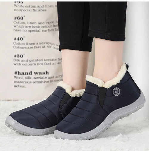 Men's waterproof winter snow boots by MANDOTOS INTERNATIONAL, outdoor work shoes in plus size with rugged tread and insulated lining.