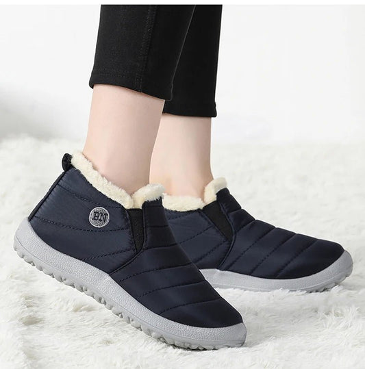 Men's waterproof winter snow boots by MANDOTOS INTERNATIONAL, outdoor work shoes in plus size with rugged tread and warm lining.