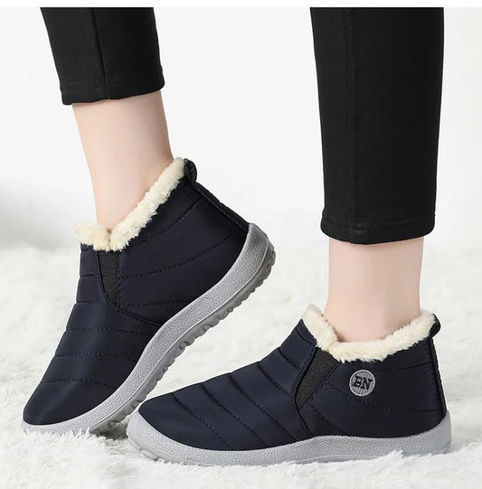 Mandotos International men's waterproof winter snow boots with rugged outdoor work shoe design, available in plus sizes.