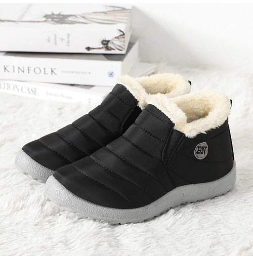Mandotos International men's waterproof winter snow boots with rugged outdoor design, suitable for work and outdoor activities in plus sizes.