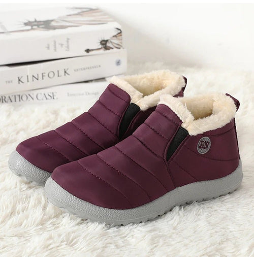 Mandotos International men's waterproof winter snow boots with rugged outdoor design, suitable for work and plus size comfort.