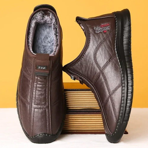 Men's winter waterproof non-slip platform work boots by Mandotos International, size 38-48, sturdy and suitable for cold weather.